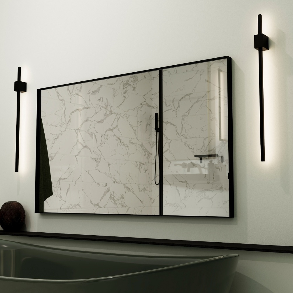 Lifestyle image of the Origins Living Newington 1200mm x 700mm Black Rectangular Mirror hanging landscape on a wall in-front of a black bathtub. NWG-001127-BK
